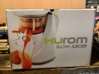 Retail box front displaying Hurom Slow Juicer image and logo