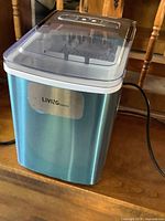 Front and side view of LivingBasics countertop ice maker