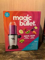 Front of sealed Magic Bullet box