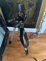 Full view of Manfrotto aluminum tripod, legs extended