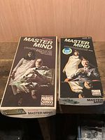 Two boxed Parker Master Mind games upright