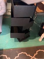 Metal tower showing open swing-out drawers