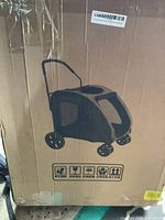 Full view of unopened box showing product illustration of wheeled pet carrier