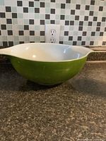 Top view of green Pyrex bowl showing interior and one handle/spout