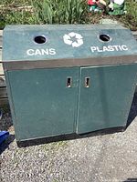 Front view showing dual openings labeled CANS and PLASTIC