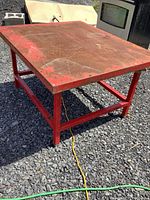 Top view of rusted flat steel surface and red frame