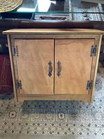 Front view of wood cabinet closed