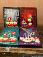 Front view of all four South Park season box sets