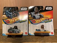 Front view of both sealed Star Wars Hot Wheels RacerVerse cars