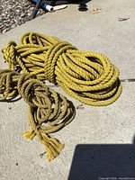 Both coiled ropes on concrete surface
