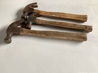Three hammers stacked showing full length