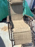 chair unfolded showing seat, frame, and headrest