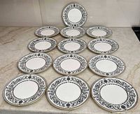 Group shot of all 13 Royal Worcester Padua bread plates