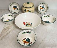 All five small bowls, serving bowl and covered jar displayed