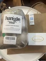 Packaged Jungle Star blanket, HealaHeel boxed set