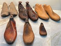 Group shot of all nine wooden shoe forms and trees