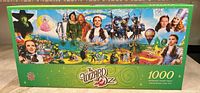 Front of sealed puzzle box showing full Wizard of Oz montage and branding