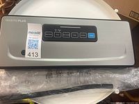 Top view of InkbirdPlus V3530 vacuum sealer control panel with MaxSold tag