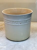 Front view showing Le Creuset logo and color