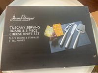 Front of sealed retail box showing Jean-Patrique Tuscany Serving Board & 3 Piece Cheese Knife Set