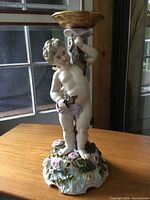 Full view of porcelain cherub candle holder