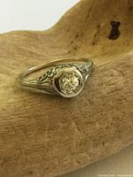 Ring front view showing diamond and bezel