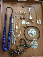 Overall view of all jewelry items on tray
