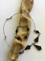 Necklace and bracelet laid out showing onyx side