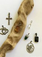 Group shot showing all seven pendants for scale and variety