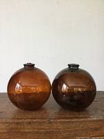 Front view of both amber glass spheres