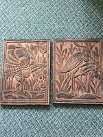Both carved wooden panels side by side showing overall design