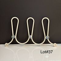 Front view showing full three-loop coat rack