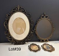 Group shot of all four ornate metal frames and mirror