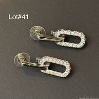 Pair of Swarovski paperclip earrings front view showing pavé crystals