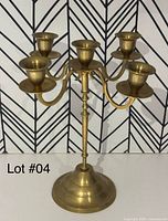 Full view showing brass five-arm candelabra