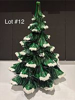 Full front view of ceramic Christmas tree showing overall design and missing bulbs