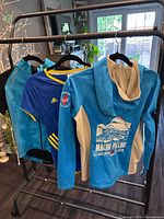 All three active tops displayed on rack