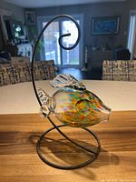 Full view of glass fish on display stand