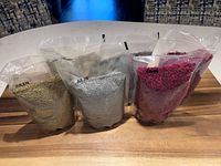 All six sealed pouches displayed upright on board