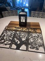 all items together: three panels laid out and lantern placed behind
