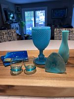 All seven blue-tone items grouped on table