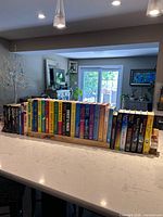 Full lot of 36 hardcover Spenser novels lined on counter