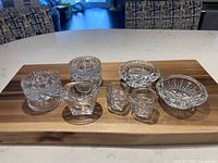 Group shot of all eight candleholders on a board