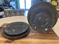 Stack of dinner and side plates showing glaze and condition