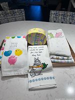 Group view showing five towels and egg box