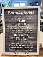 Front view of framed “Family Rules” print