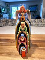 All four figurines nested together showing complete set