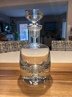 Front view showing decanter form and stopper