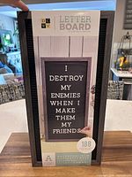 Front of packaged DCWV letter board showing size and included characters