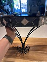 Side view of shelf showing tile design and metal frame
